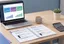 QuickBooks workflow documentation on a laptop showing accounts payable, receivable, and reconciliation steps captured as an SOP
