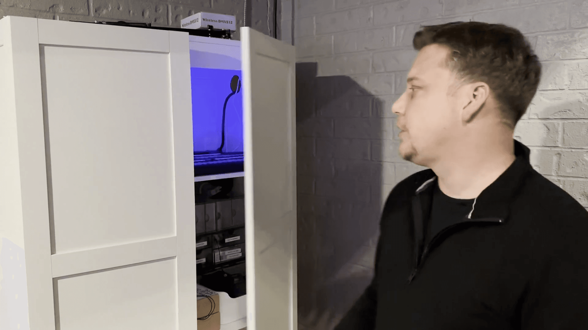 Step #1: Open the white cabinet in the corner of the sound booth.