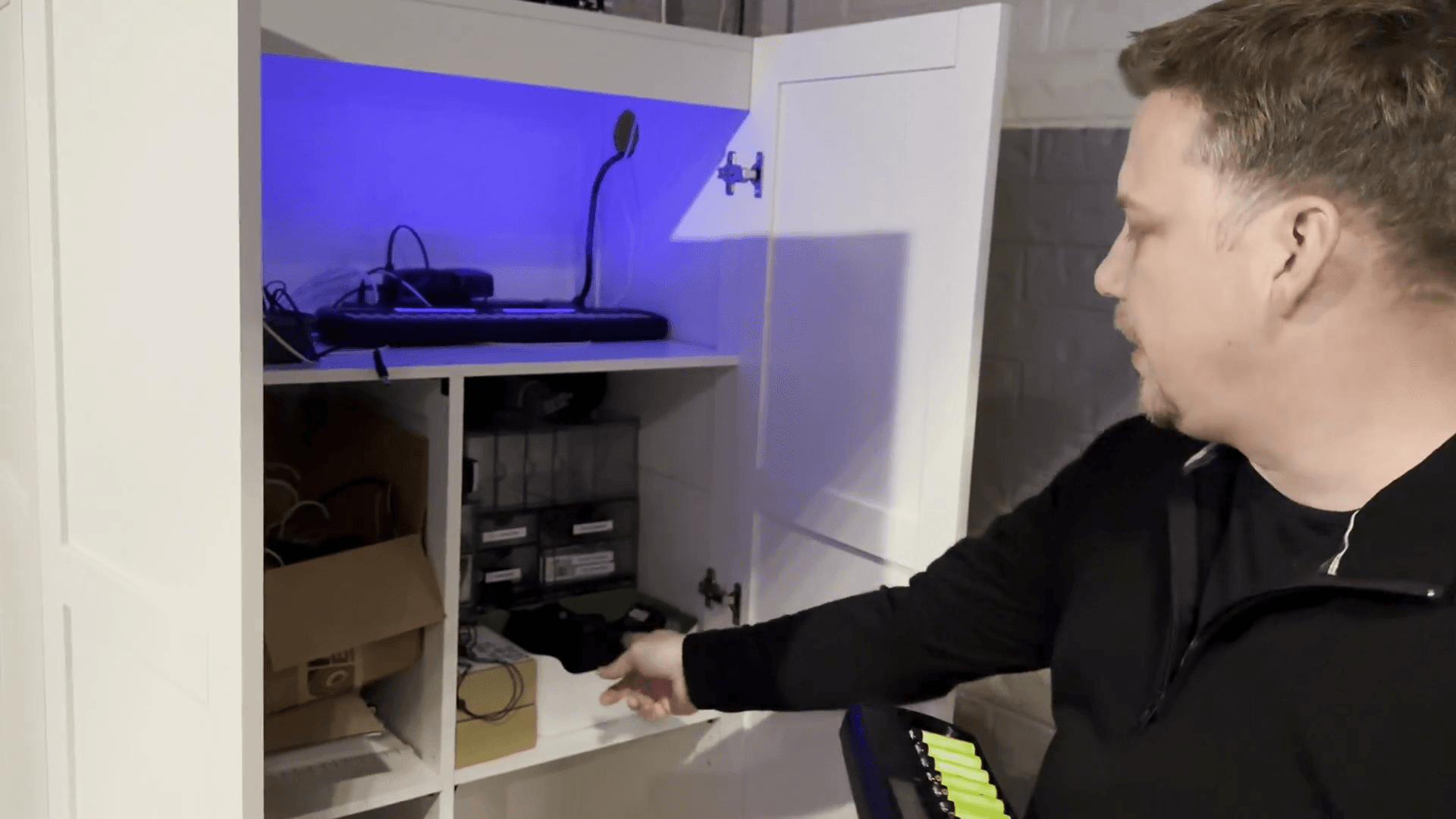 Step #4: Take the microphone packs from the bin in the cabinet.