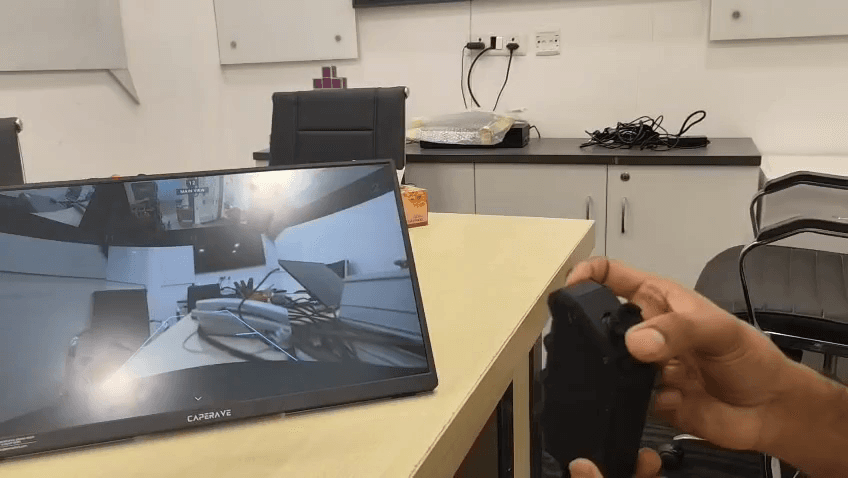 Step #22: Push the joystick down to switch to the rear camera feed.