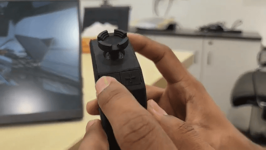 Step #18: Press the plus (+) and minus (-) buttons located below the joystick to zoom your current camera feed in or out.