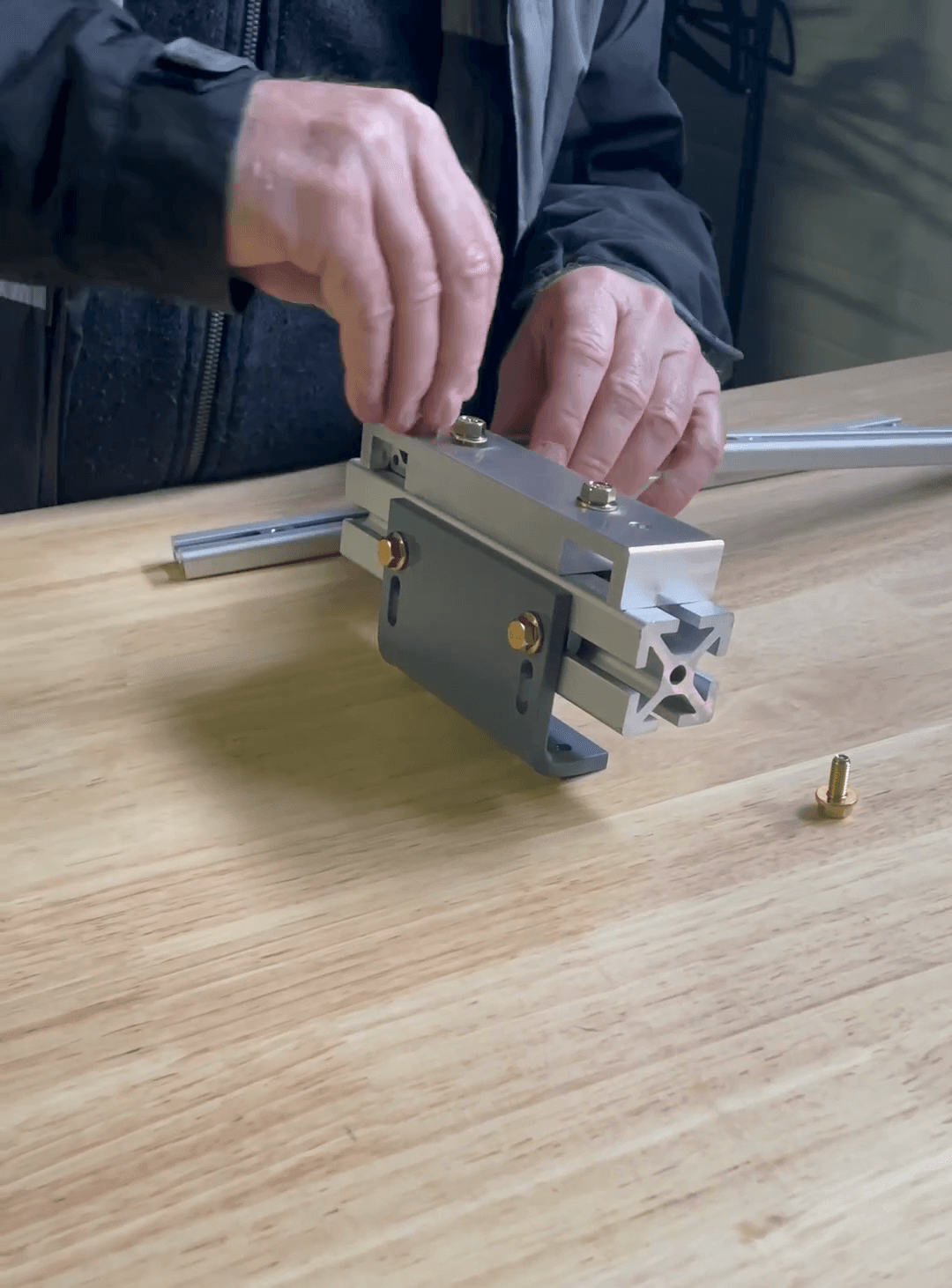 Step #8: Re-insert and hand-tighten the bolt to secure the rail.