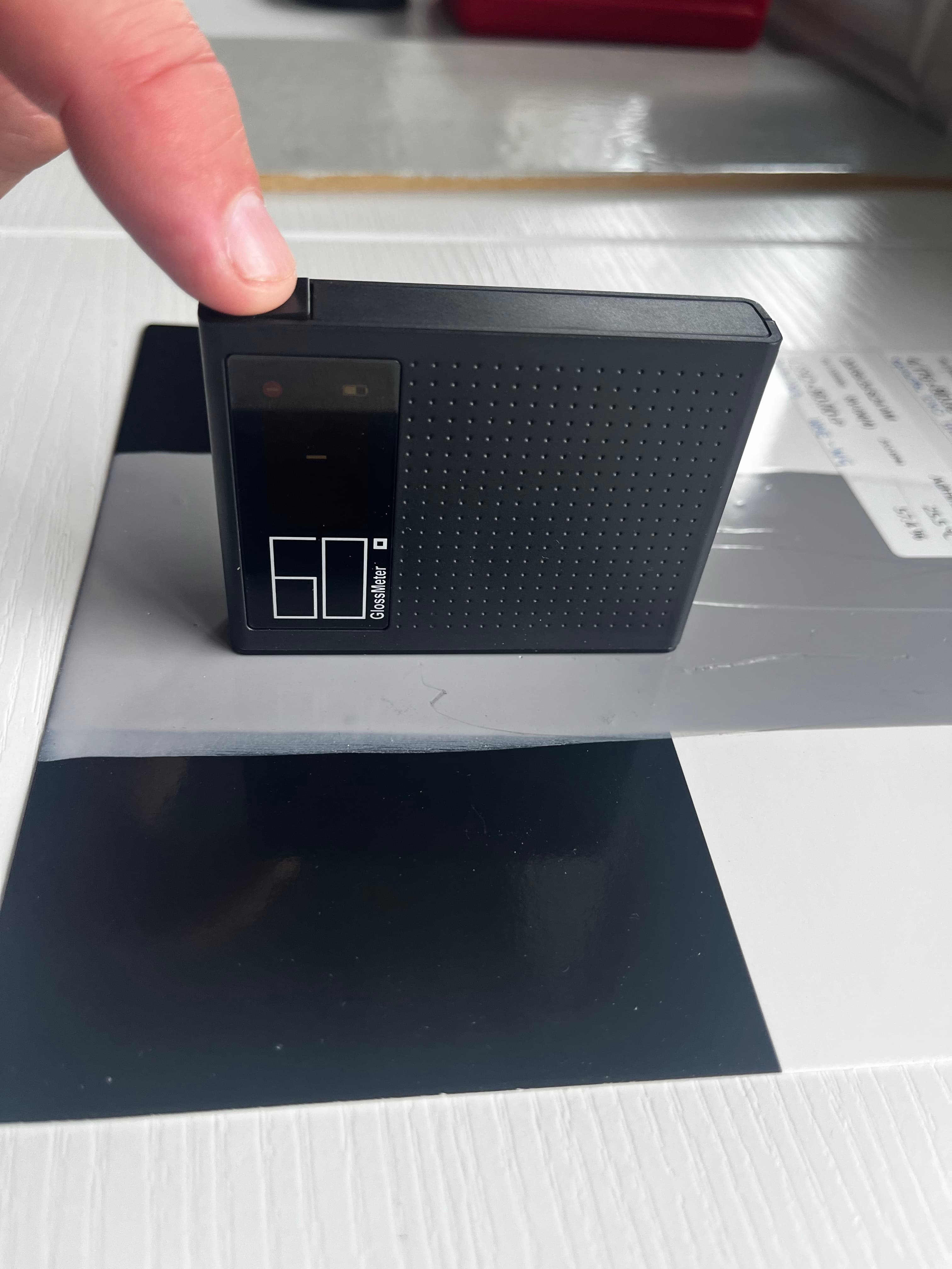 Step #4: Place the reader onto a cured sample and take the reading by pressing the power button once.